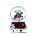 Christmas Theme Snow Globe On A Shed With Music